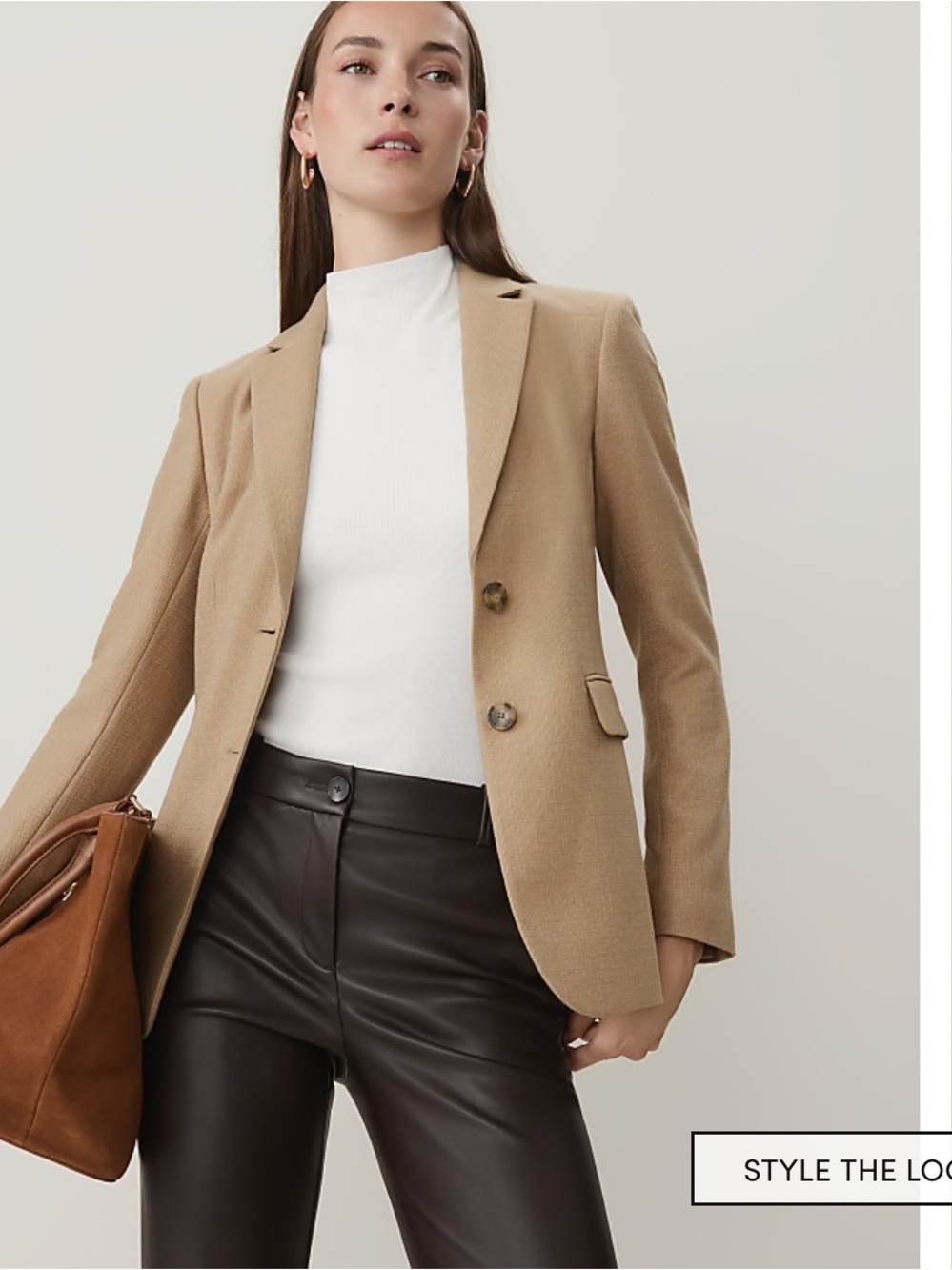 Ann Taylor Petite suit jacket with a two-button closure and front flap pockets.